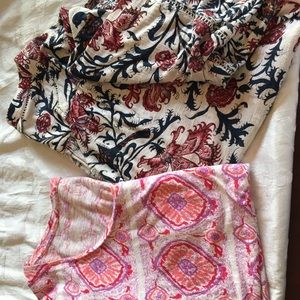 Two Lucky T shirts.  1 shirt sleeve. Other is 3/4